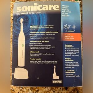 NEW IN BOX sonicare toothbrush plus model with quad pacer and charging cord